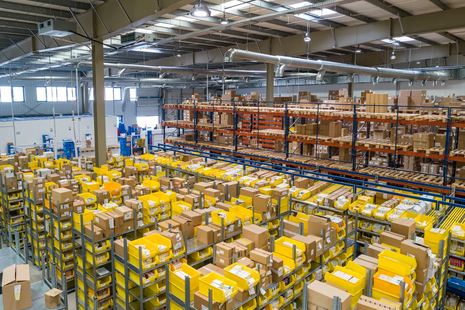 A wholesale distribution warehouse with racked inventory and order-picking bins